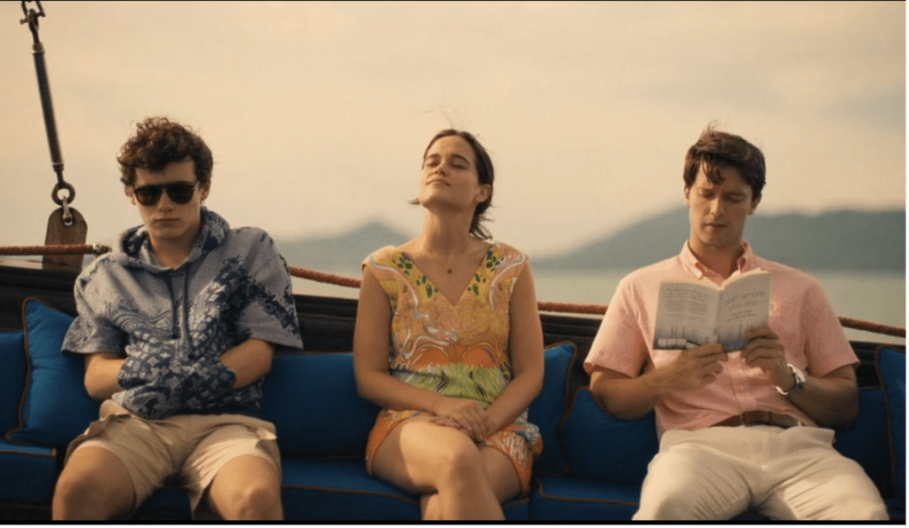 Lochlan (Sam Nivola), Piper (Sarah Catherine Hook) and Saxon (Patrick Schwarzenegger) set off in the boat after their life-changing stay at The White Lotus. Photo by HBO.